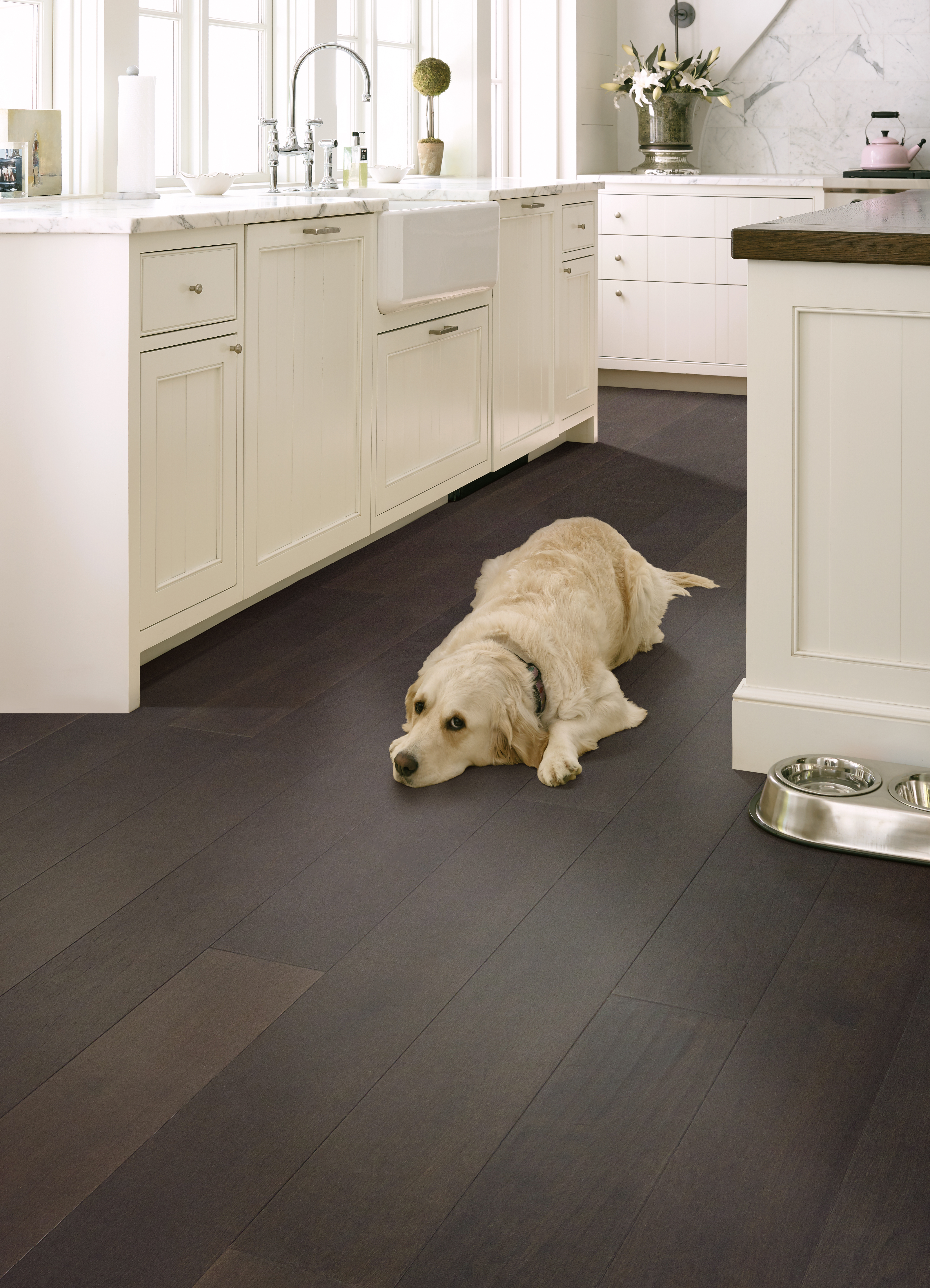 Hardwood flooring in a kitchen, installation services available. 