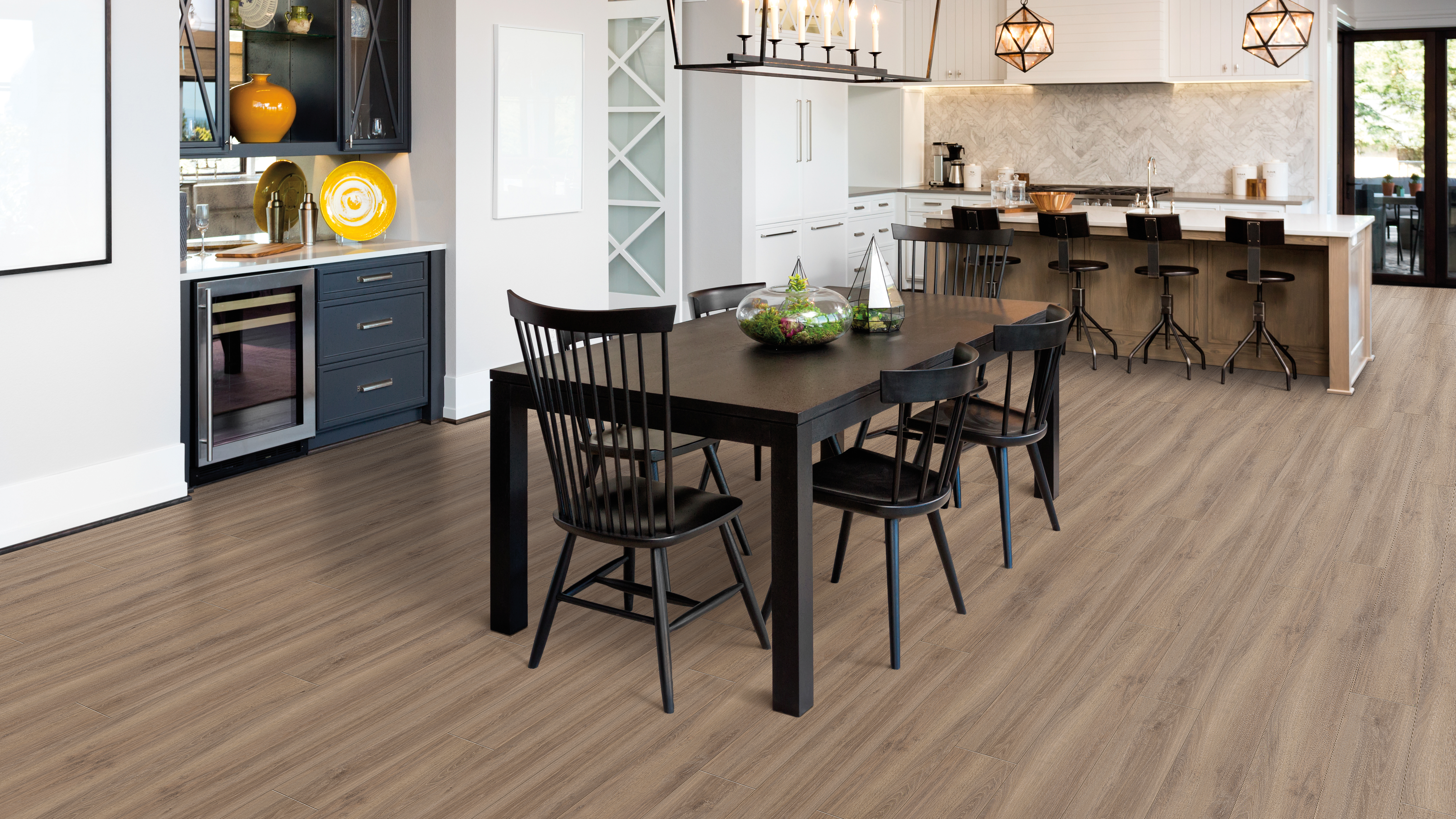 Luxury vinyl flooring in a dining room, installation services available.